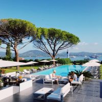 Relax by the infinity pool at a Saint-Tropez resort with stunning Mediterranean views.